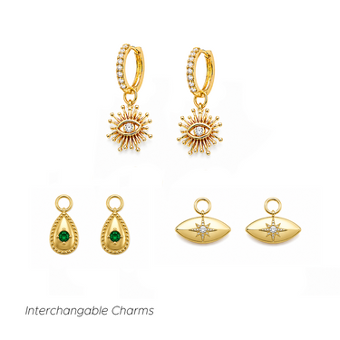 Dakota Charm Earrings Gold interchangeable huggie earring set featuring evil eye charms, green gemstone teardrop charms and celestial eye charms.