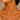 Close-up of a woman wearing a silver necklace with a sunflower pendant against a neutral background
